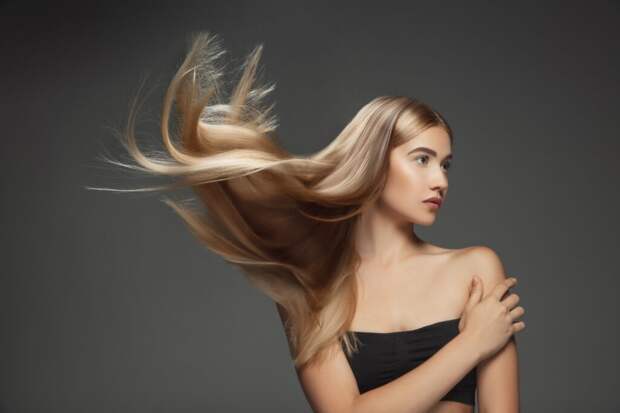 beautiful-model-with-long-smooth-flying-blonde-hair-isolated-dark-grey-studio-background-young-caucasian-model-with-well-kept-skin-hair-blowing-air-1024x683 Как ускорить рост волос? Полезные советы