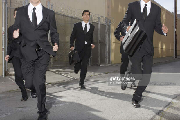 Businessmen running
