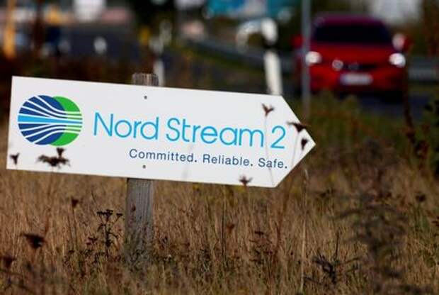 A road sign directs traffic towards the Nord Stream 2 gas line landfall facility entrance in Lubmin, Germany, September 10, 2020. REUTERS/Hannibal Hanschke