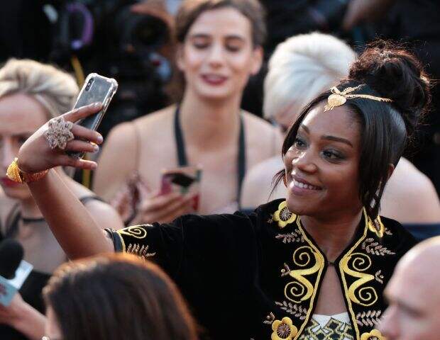 Tiffany Haddish arrives for the 90th Annual Academy Awards on March 4, 2018, in Hollywood, California. / AFP PHOTO / Kyle GRILLOTKYLE GRILLOT/AFP/Getty Images