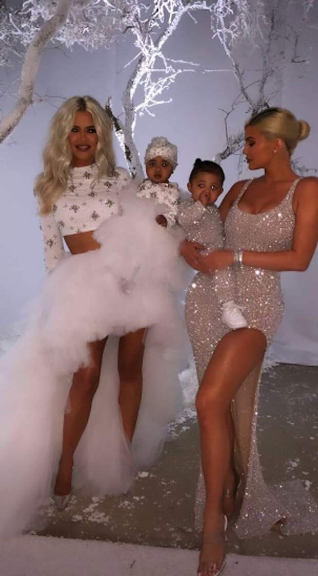 When it comes to Christmas parties, few can top the Kardashian-Jenner family's. Every year, the brood pulls out all the stops for their Christmas Eve bash, and on Monday, Kim and Kanye West had the honor of hosting it at their Calabasas, CA, home. The bash brought out the family's nearest and dearest, including Kendall, Kourtney, Khloé, Kris, and Kylie and pals Paris Hilton, Jennifer Lopez, Alex Rodriguez, Kimora Lee Simmons, Chrissy Teigen, and John Legend, who performed songs from his Christmas album, A Legendary Christmas. Kim and Kanye basically transformed their home into a Winter wonderland featuring artificial snow, an igloo, a sled setup, and tons of desserts. 