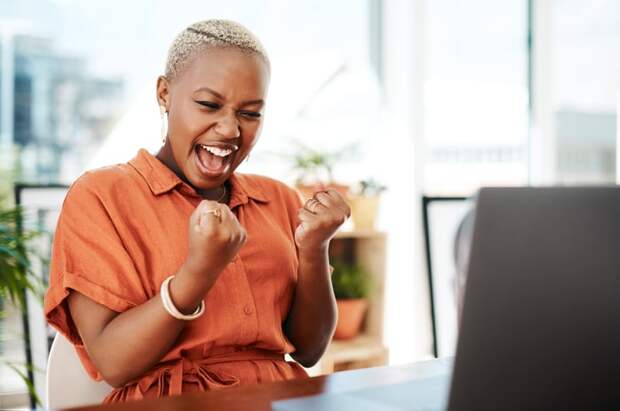A person pumps their fist in victory.