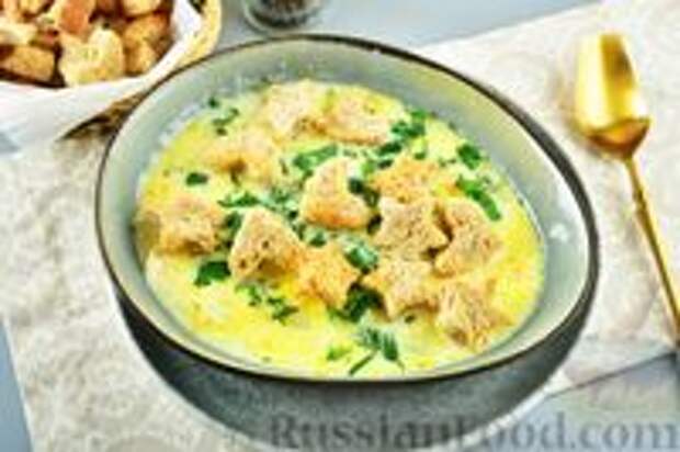 Фото к рецепту: Суп с курицей, рисом и плавленым сыром