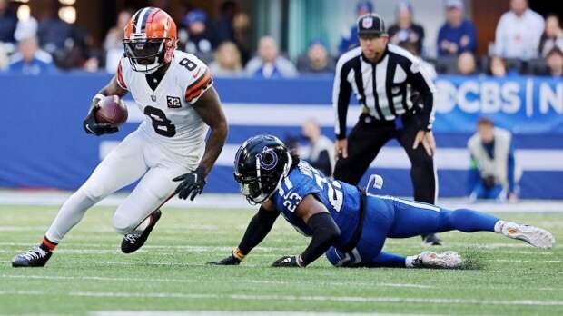 Elijah Moore runs past a Colts defender.