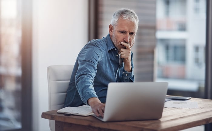 A person at a laptop.