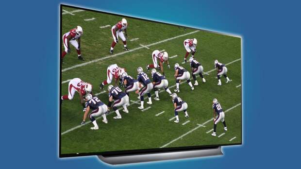 Large screen television displaying a football game in progress