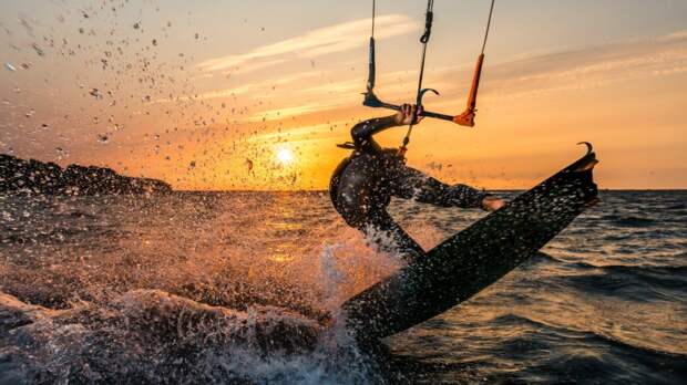 Kite Surfer Jumps Over NC Fishing Pier During Hurricane Nicole