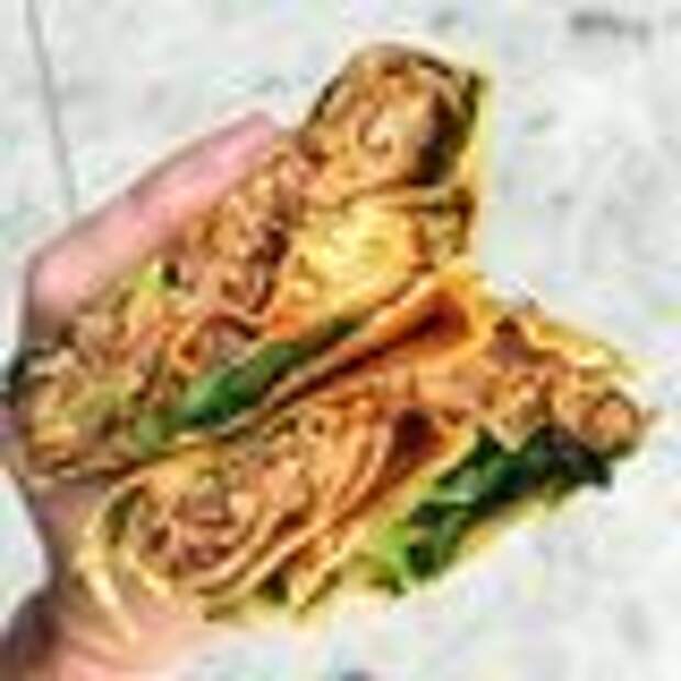 Savory crepe with cooked egg, scallion, cilantro, chili, and 13-spice pork.
