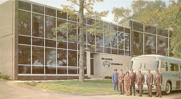 LeFevres in front of their bus