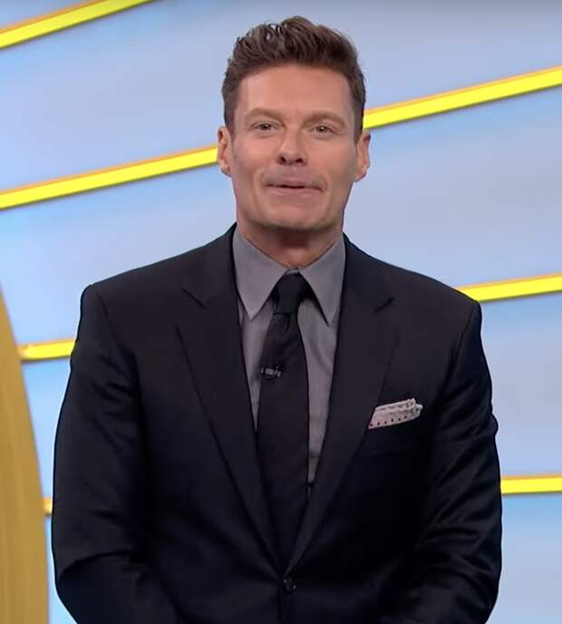 Ryan Seacrest talks to the audience on Wheel of Fortune.