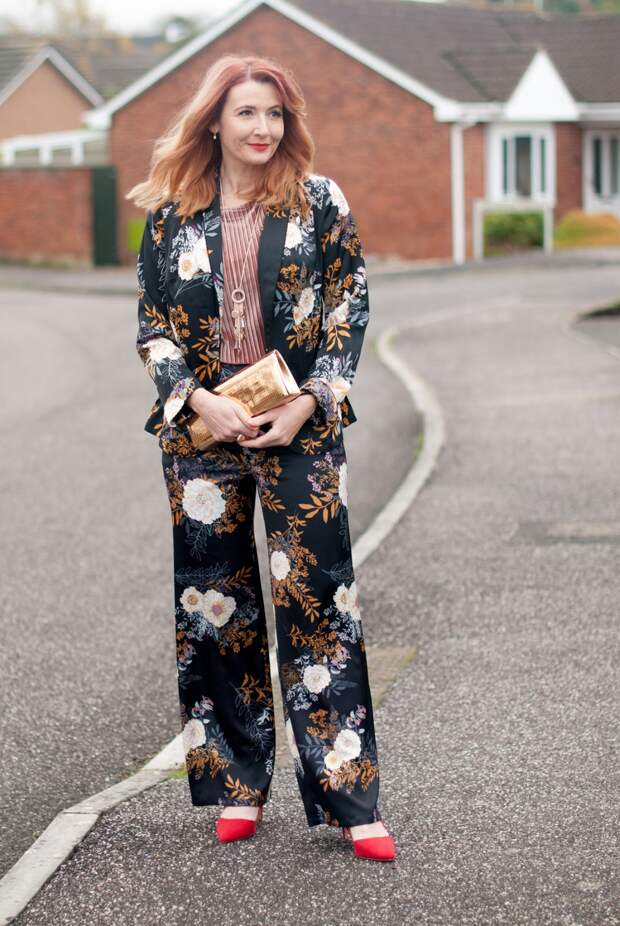 Floral pyjama pajama-style suit, Christmas party outfit: Trouser/pants suit with red heels, pink velvet top and gold mirror clutch | Not Dressed As Lamb, over 40 fashion