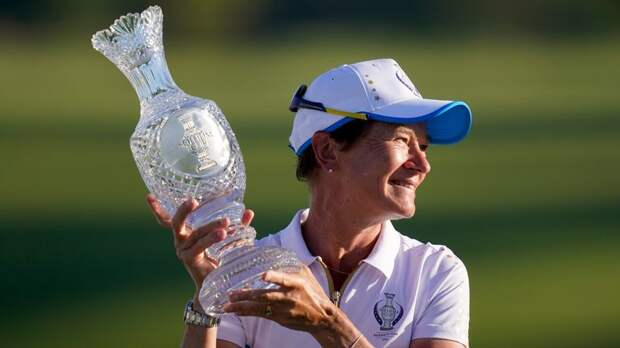 Europe captain Catriona Matthew holds up the Solheim Cup trophy