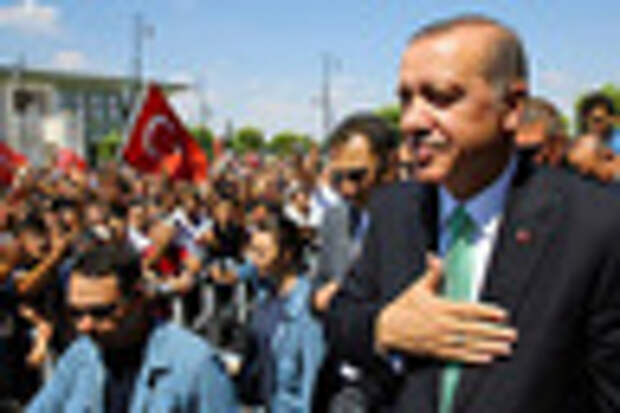 In this Friday, July 22, 2016 photo, Turkey's President Recep Tayyip Erdogan, acknowledges the crowd as he arrives at the parliament in Ankara, Turkey. Turkish lawmakers approved a three-month state of emergency that allows the government to extend detention times and issue decrees without parliamentary approval. (Press Presidency Press Service via AP, Pool)