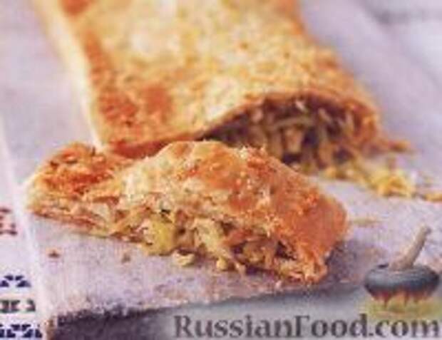 Фото к рецепту: Слоеный пирог с капустой и яйцами