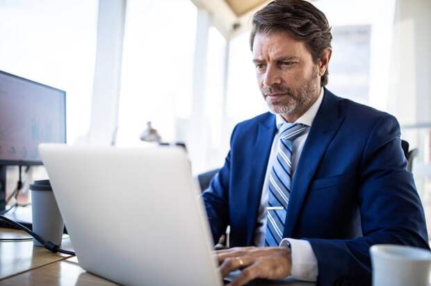 A person at a laptop.