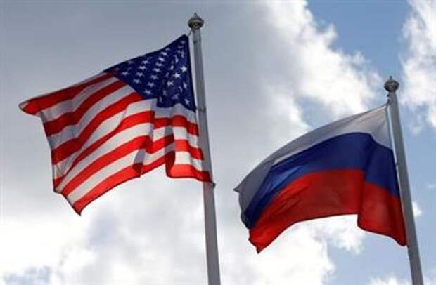 FILE PHOTO: Russian and U.S. state flags fly near a factory in Vsevolozhsk, Leningrad Region, Russia March 27, 2019. REUTERS/Anton Vaganov/File Photo/File Photo