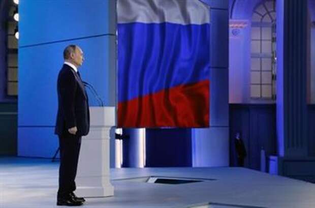 Russian President Vladimir Putin listens to the national anthem after delivering his annual address to the Federal Assembly in Moscow, Russia April 21, 2021. Sputnik/Mikhail Metzel/Kremlin via REUTERS ATTENTION EDITORS - THIS IMAGE WAS PROVIDED BY A THIRD PARTY.