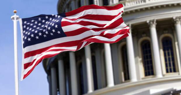 An American flag flying in front of a government building in Washington.
