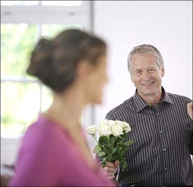 mature_man_holding_white_roses_for_woman_20294 mature_man_holding_white_roses_for_woman_20294