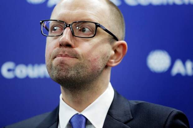 WASHINGTON, DC - MARCH 12: Ukraine Prime Minister Arseniy Yatsenyuk speaks at a news conference at the Atlantic Council on March 12, 2014 in Washington, DC. Yatsenyuk was in Washington to discuss the current situation of the Russian military intervention in the Crimea area.   T.J. Kirkpatrick/Getty Images/AFP