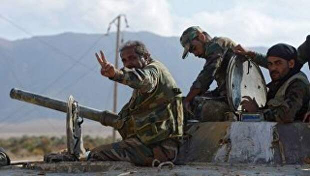 Бойцы армии САР прорвавшие трехлетнюю осаду города Дейр-эз-Зор в районе территории 137-й механизированной бригады