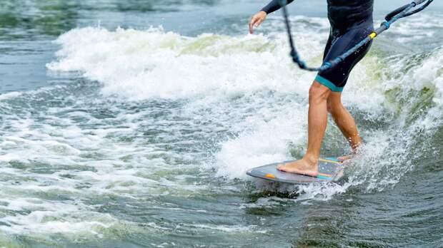 wake surfing closely behind a boat