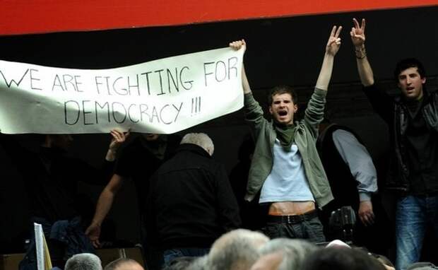 Georgian opposition activists display a