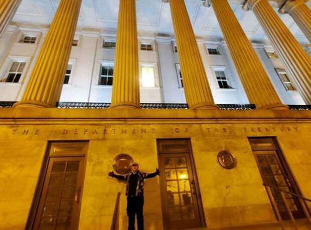 Mike Dunn, a prominent leader of the anti-government Boogaloo movement, poses for a photo outside the Treasury building in Washington, D.C., U.S., January 6, 2021. Picture taken January 6, 2021. Mike Dunn/Handout via REUTERS ATTENTION EDITORS - THIS IMAGE HAS BEEN SUPPLIED BY A THIRD PARTY.