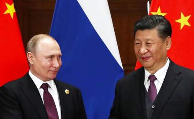 На фото: президент РФ Владимир Путин и председатель КНР Си Цзиньпин (слева направо).