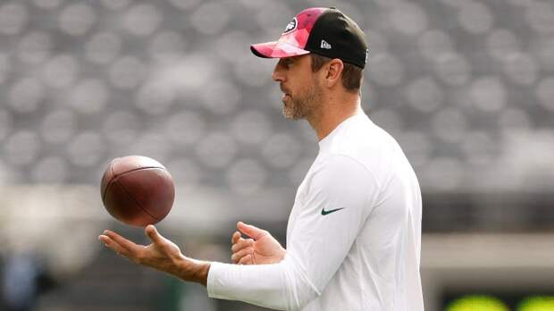 Aaron Rodgers throws a pass in pregame warmups.