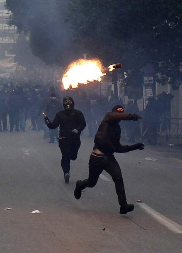 Protesters throw petrol bombs at police during riots in Athens