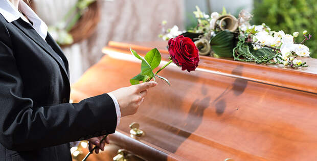 Mourning Woman at Funeral with coffin