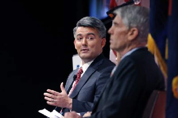 Senatorial candidate U.S. Rep. Cory Gardner, R-Colo., (left) gestures during a debate with incumbent U.S. Sen. Mark Udall, D-Colo., in Denver, on Monday, Oct. 6, 2014. The two are locked in what many polls report is a tight race, less than one month before election day on Nov. 4, 2014. (AP Photo/Brennan Linsley)