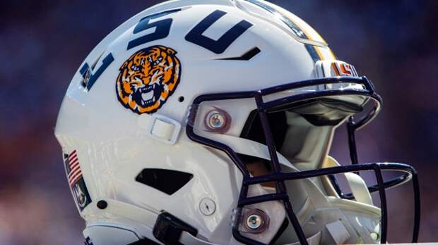 An LSU football helmet on the sidelines during a game.