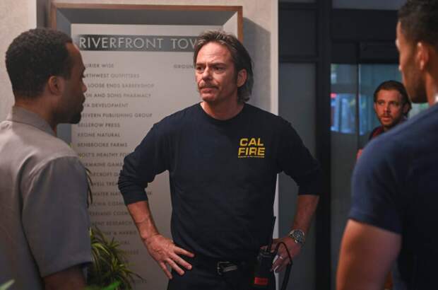 Vince chats with a colleague