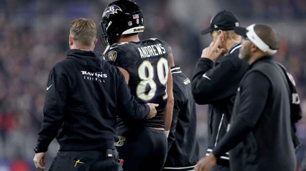 Mark Andrews walks off the field after being injured.