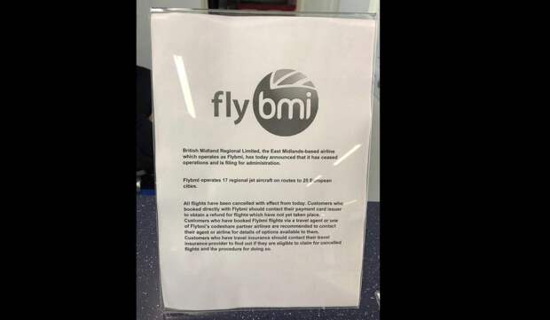 A notice informing passengers that flybmi flights have been cancelled following the collapse of the airline, at Bristol Airport in Bristol, England, Sunday, Feb. 17, 2019. Hundreds of passengers have been stranded by the abrupt collapse of the British regional airline Flybmi. The airline says it's filing for administration _ a British version of bankruptcy because of higher fuel costs and uncertainty caused by Britain's upcoming departure from the European Union. (PA via AP)