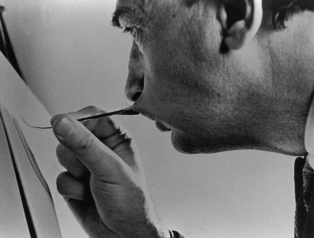 Salvador Dali painting with his mustache, 1954
