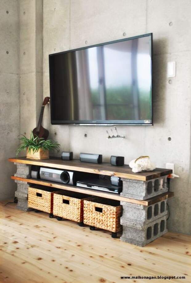 DIY cinder block TV cabinet. Put wheels under basket as drawers for DVD's etc. No nails or hammers necessary. All this for under $60! Design by Maiko Nagao.: 