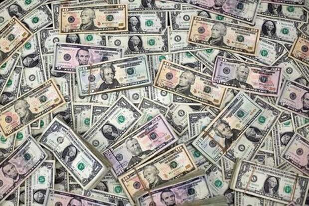 U.S. Dollar banknotes are seen in this photo illustration taken February 12, 2018. REUTERS/Jose Luis Gonzalez/Illustration, Владимир Абрамов, Андрей Остроух