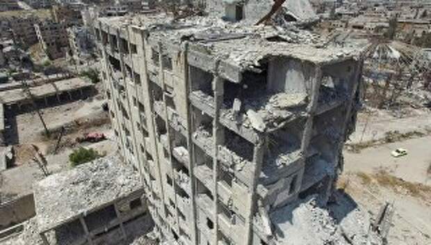 Разрушенное здание в квартале Бани-Зейд на севере Алеппо