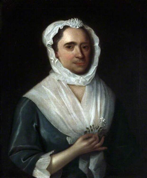Portrait of a Woman Wearing a Blue Silk Dress Holding a Jasmine Flower Portrait of a Woman Wearing a Blue Silk Dress Holding a Jasmine Flower