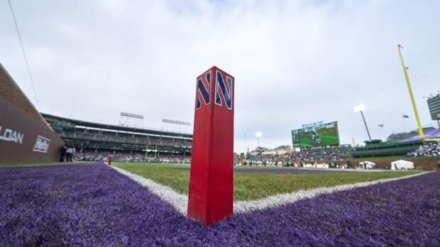 A Northwestern logo on a pylon in the endzone.