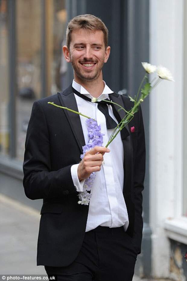 Clutching the remnants of a battered bouquet a smoking a pipe, exhausted revellers make their way home on Tuesday