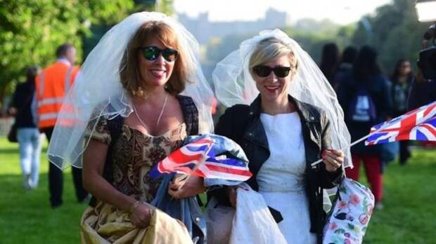 Women wear wedding dresses on the Long Walk