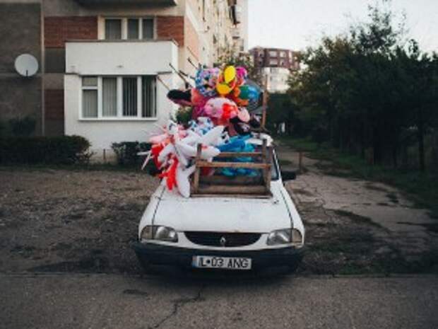 His Photography Captures the Peculiarity & Humor In This Small Town In Romania