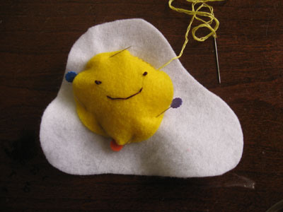 felt egg pincushion sewing on the yolk