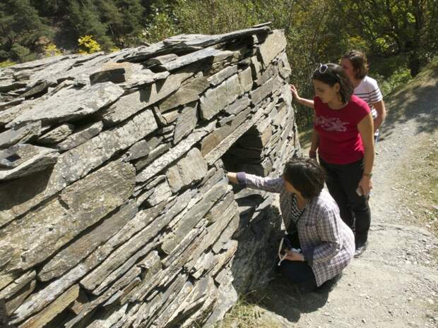 Visitors peer into the crypts of Anatori, Georgia