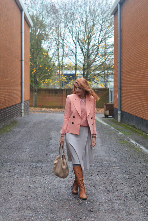Peach tailored jacket, grey midi skirt, tan boots