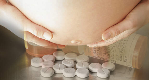 a photo of a pregnant stomach with some pills